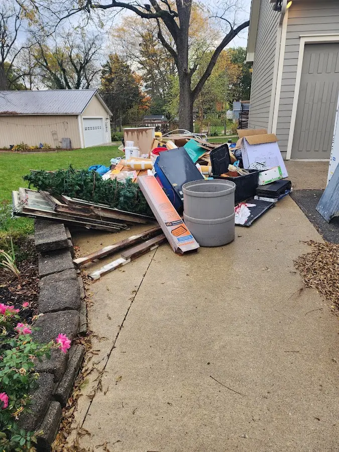Dumpster being loaded with debris for Residential Dumpster Rental in Lemoore Station